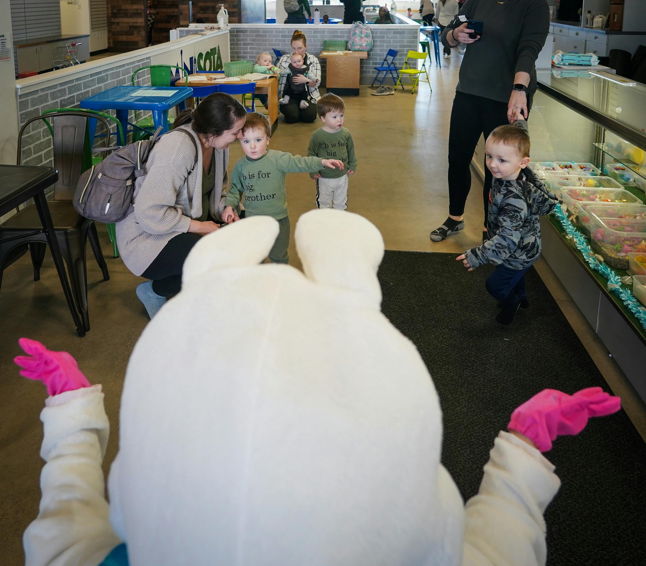 The Easter Bunny stops to say hello at the MiniSota Cafe in Maple Grove, Minn.