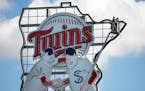 Minnie and Paul, high above Target Field, will overlook a nearly empty stadium for Tuesday's home opener against the Cardinals.