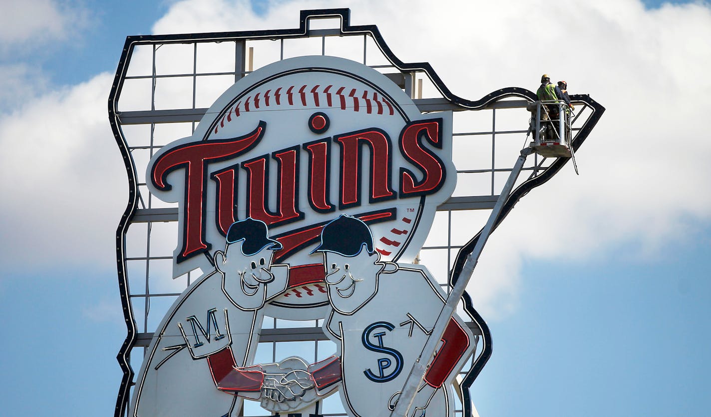 Minnie and Paul, high above Target Field, will overlook a nearly empty stadium for Tuesday's home opener against the Cardinals.