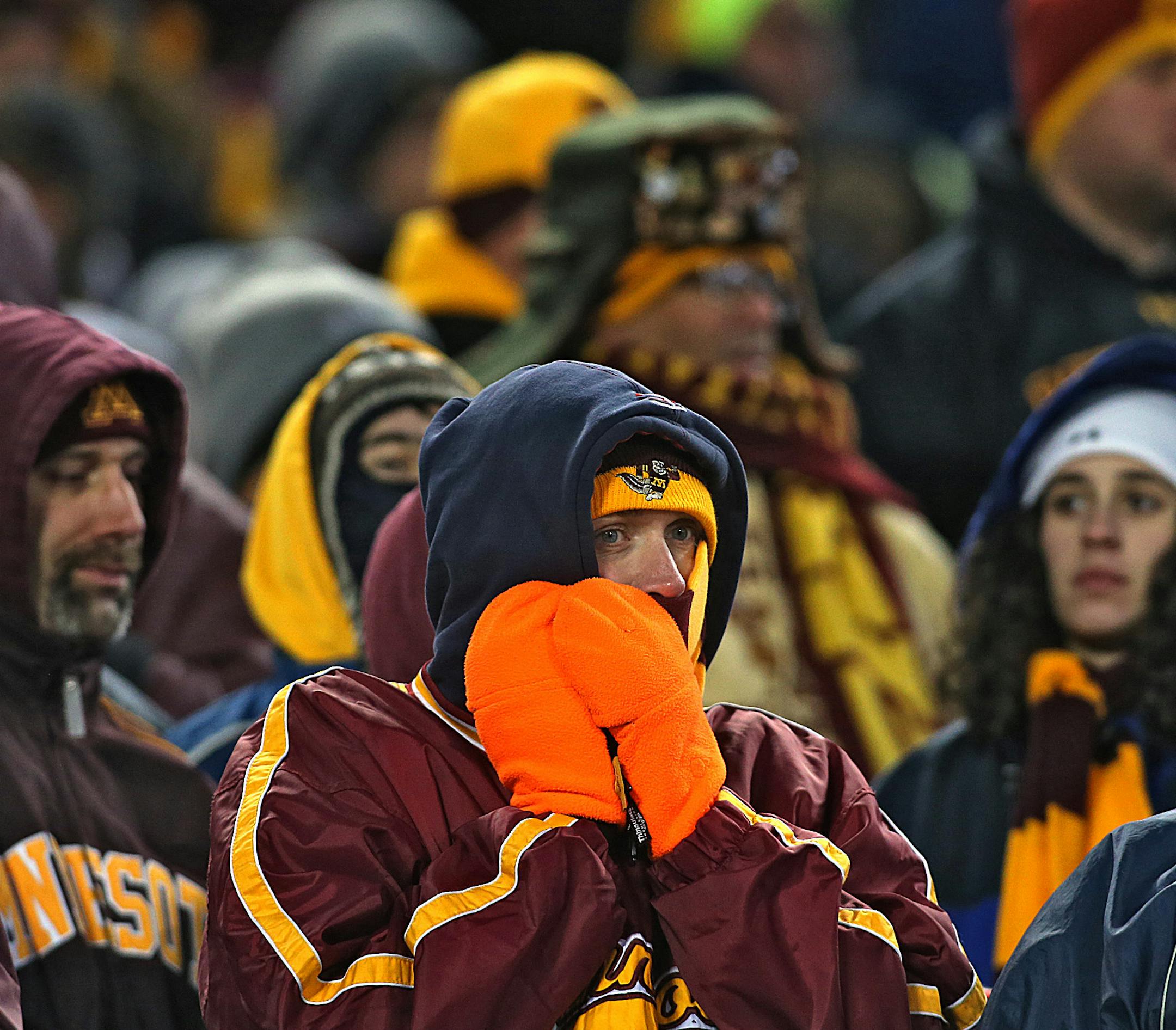 A sold out crowd filled the stadium, with fans bundling up to fight the cold and wind. ]JIM GEHRZ &#xef; jgehrz@startribune.com Minneapolis, MN / November 23, 2013, 2:30 PM BACKGROUND INFORMATION- The Minnesota Golden Gopher football team played the Wisconsin Badgers at TCF Bank Stadium. Wisconsin won the game 20-7. ORG XMIT: MIN1311231846442094