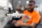 Chris Spangler of Bloomington hovered a drone a few feet from him as he waited for the start of the professional races.