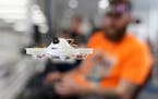 Chris Spangler of Bloomington hovered a drone a few feet from him as he waited for the start of the professional races.