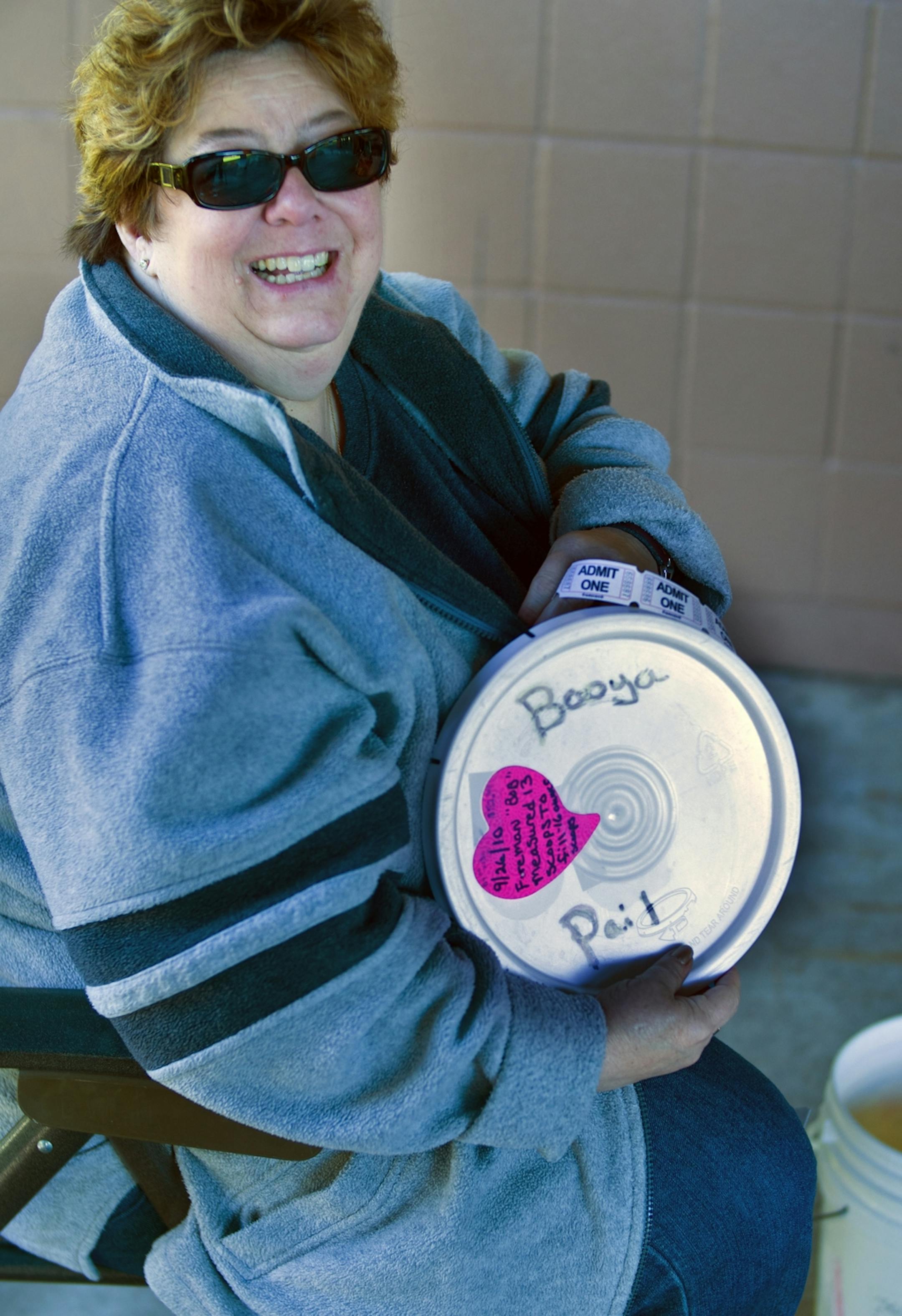 At Casey Lake Park in North St. Paul where the fire department held its annual booya fundraiser, Kathy Orin who has been coming for 20 years was first in line for some 16 bowls of stew she was taking home in her special pails.