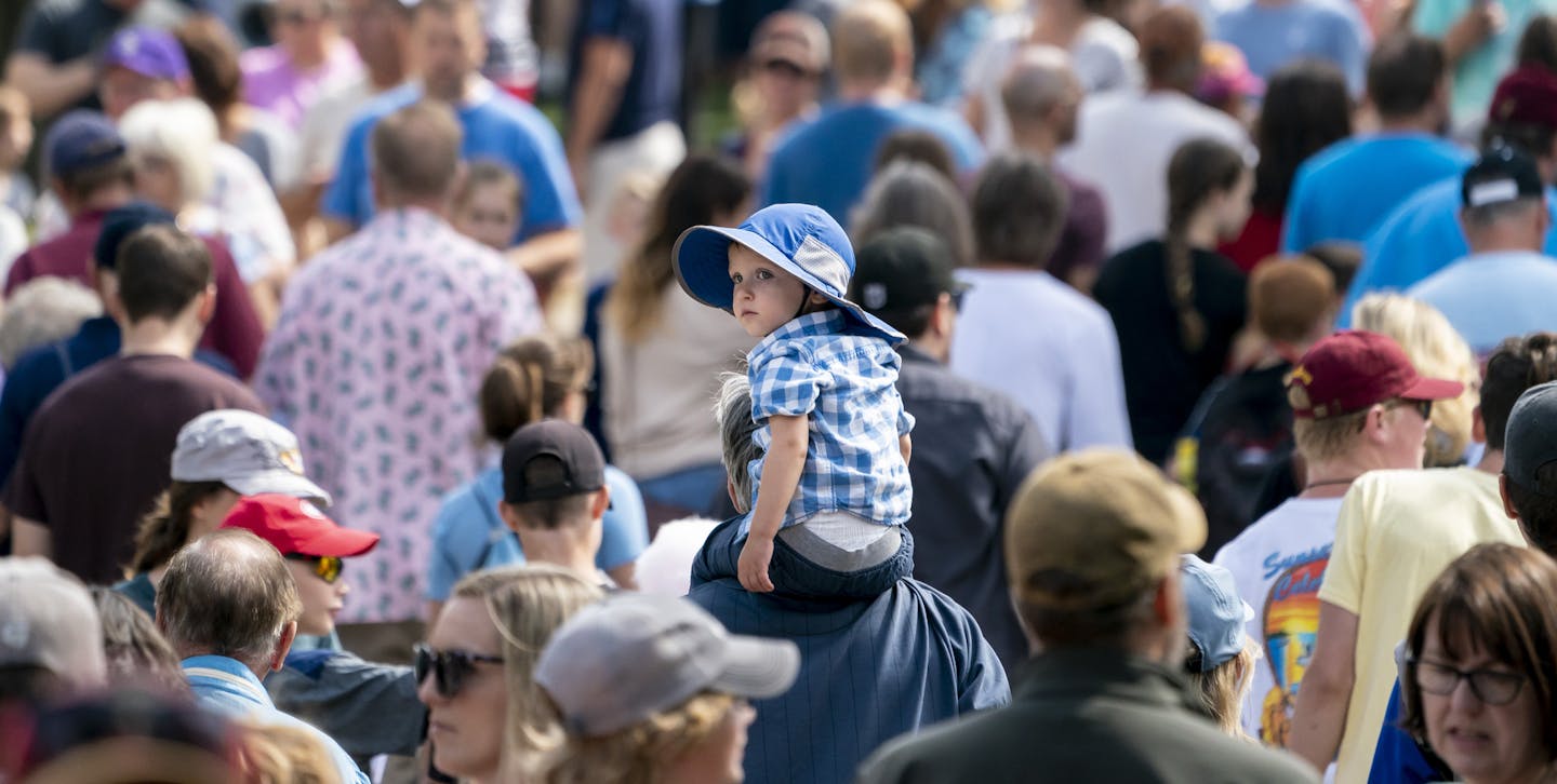 Eddie Hoeschen, 2, rode on his grandpa Kevin Hoeschen's, of Duluth, shoulders as they walked through a thick crowd at the Minnesota State Fair in Falcon Heights, Minn., on Friday, August 23, 2019. ] RENEE JONES SCHNEIDER &#xa5; renee.jones@startribune.com Kids perspective of the fair