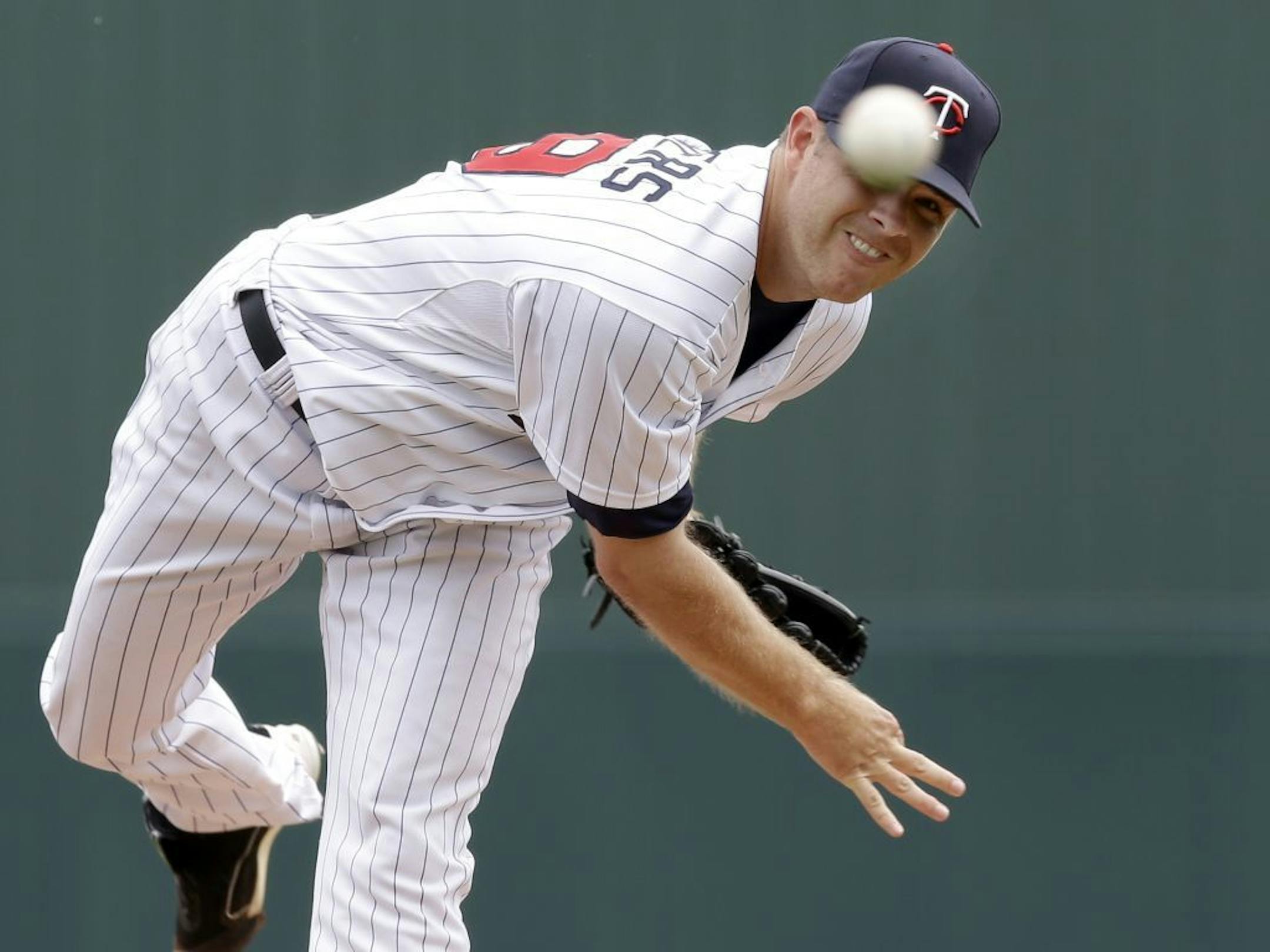 Minnesota Twins starting pitcher P.J. Walters delivers to the Toronto Blue Jays in the first inning of an exhibition spring training baseball game in Fort Myers, Fla., Sunday, March 24, 2013.