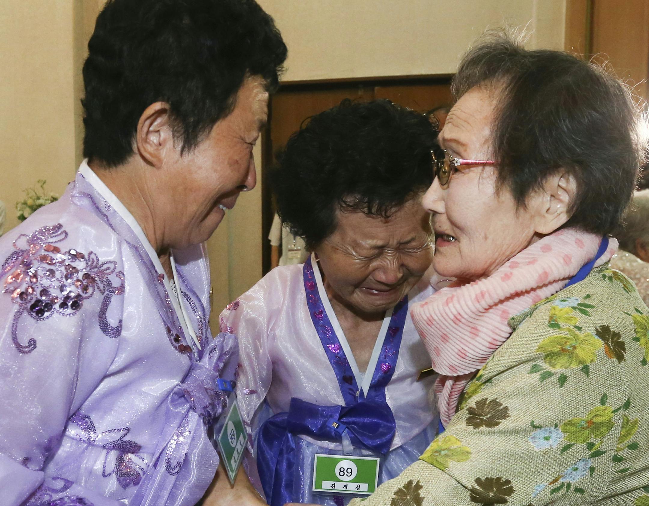 South Korean Han Shin-ja, 99, right, weeps with her North Korean daughters Kim Kim Kyong Yong, 71, and Kim Kyong Sil, 72, center, during the Separated Family Reunion Meeting at the Diamond Mountain resort in North Korea, Monday, Aug. 20, 2018. Dozens of elderly South Koreans crossed the heavily fortified border into North Korea on Monday for heart-wrenching meetings with relatives most haven't seen since they were separated by the turmoil of the Korean War. (Korea Pool Photo via AP)