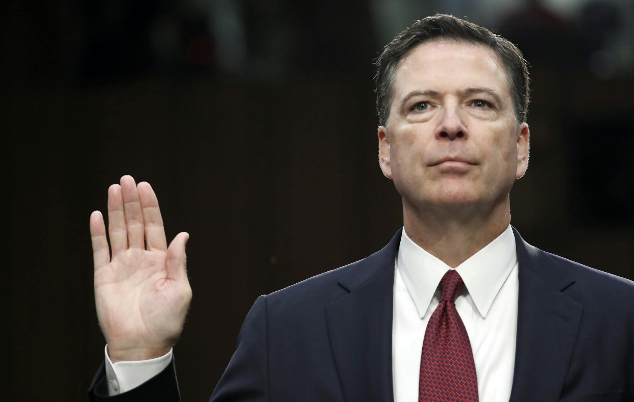 Former FBI Director James Comey is sworn in during a Senate Intelligence Committee hearing on Capitol Hill, Thursday, June 8, 2017, in Washington. (AP Photo/Alex Brandon)