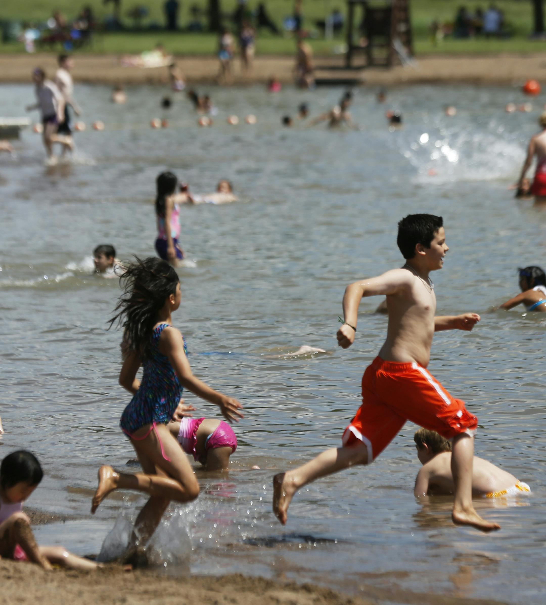 At the Lake Elmo Park Preserve swimming beach, hundreds of people enjoyed the weather on Memorial day .] rtsong-taatarii@startribune.com,
