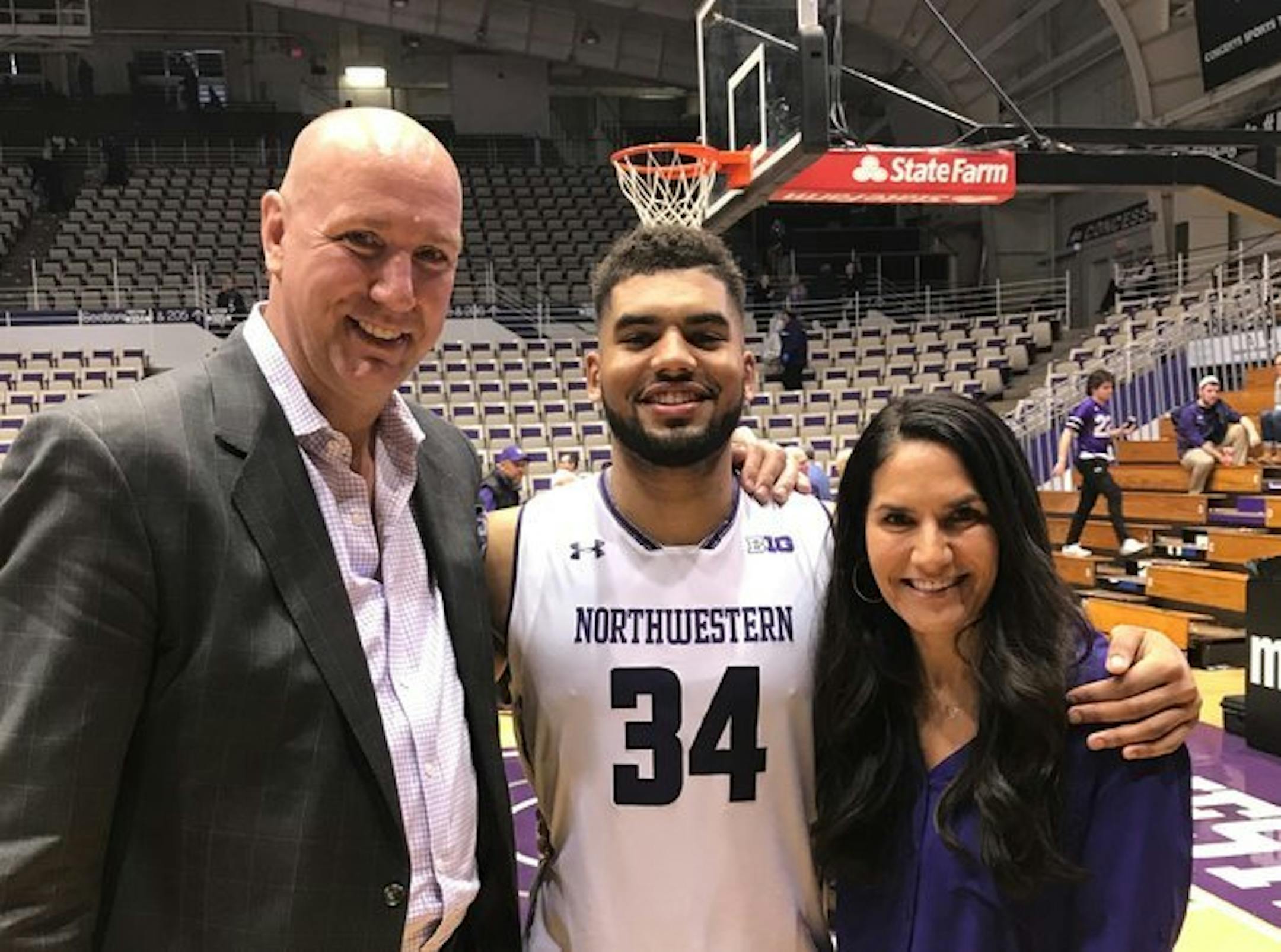 Northwestern senior Sanjay Lumpkin, who played high school basketball at Benilde-St. Margaret's, with his parents Jim and Tika Petersen.