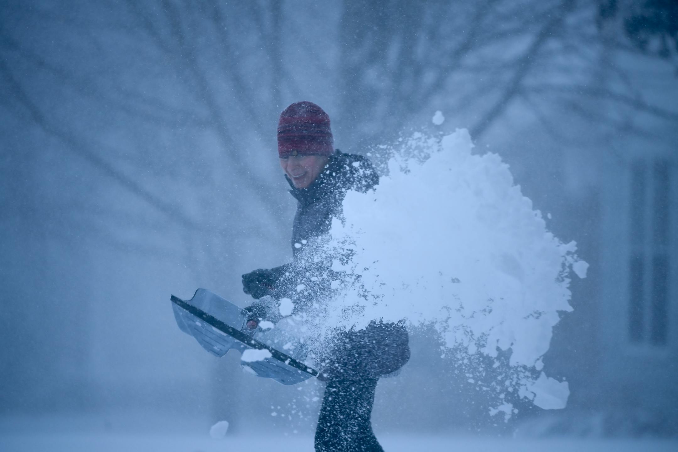 Camilla Cruz, a float nurse at North Memorial Health Hospital, shoveled her driveway Wednesday afternoon in Robbinsdale.