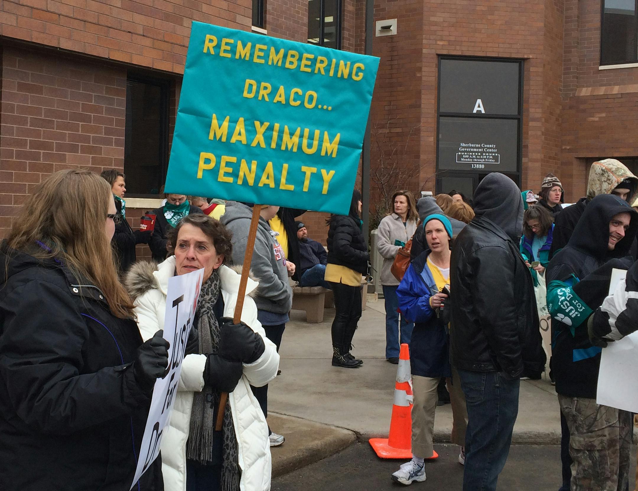 Dozens of protesters rallied outside the Sherburne County Courthouse Wednesday, calling for harsh punishment for a man who videotaped himself smiling as he tortured and killed his girlfriend's dog.