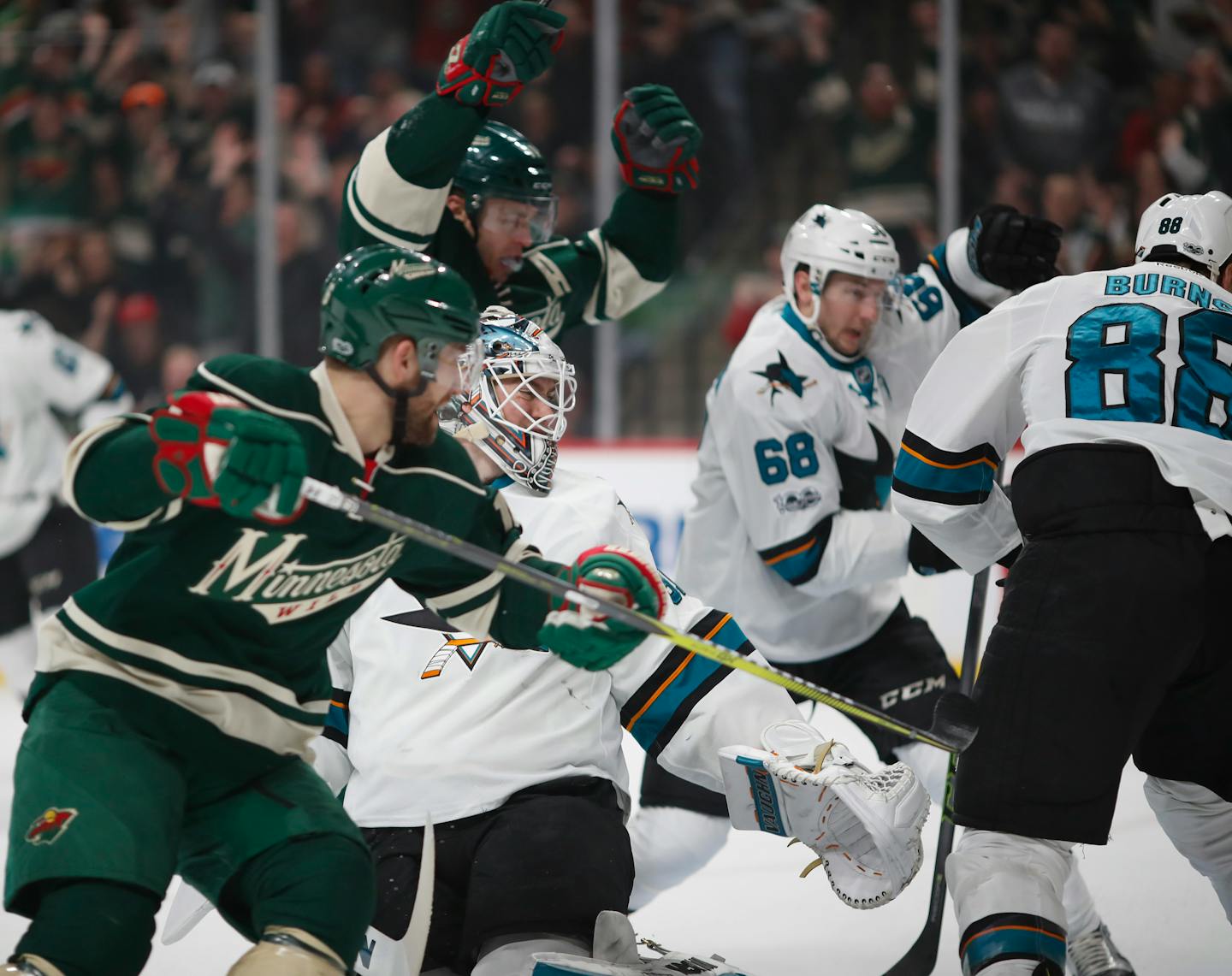 Wild left winger Zach Parise (background) celebrated after he slipped the puck between the legs of Sharks goalie Martin Jones (31) in the first period Sunday, his first goal since returning to the lineup after a bout with the mumps.