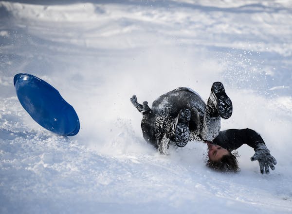 Bobby Wiesner, 15, a student at Southwest High School, was upended as he sledded down the hill at Beard's Plaisance Tuesday.