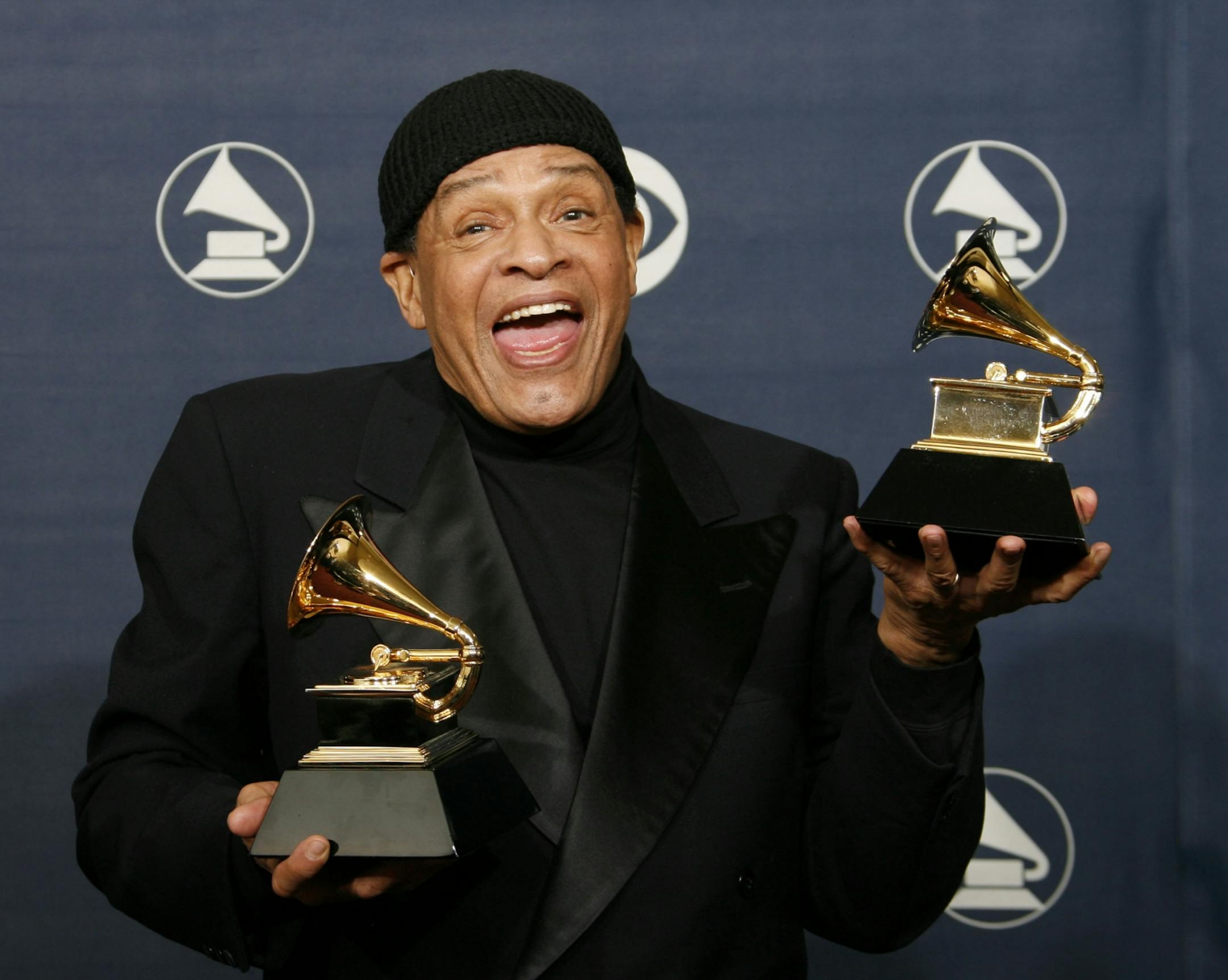 FILE - In this Sunday, Feb. 11, 2007, file photo, Al Jarreau poses with his awards for best pop instrumental performance for "Mornin'" and best traditional R&B vocal performance for "God Bless the Child" at the 49th Annual Grammy Awards in Los Angeles. Jarreau died in a Los Angeles hospital early Sunday, Feb. 12, 2017, according to his official Twitter account and website.