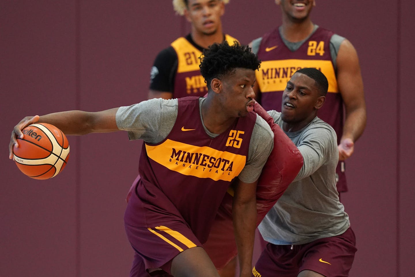 Gophers center Daniel Oturu (25) took part in a drill during a practice in early August.