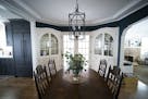 Designer Tasha Schultz combined a vintage dining set with on-trend navy blue paint in her Falcon Heights dining room.