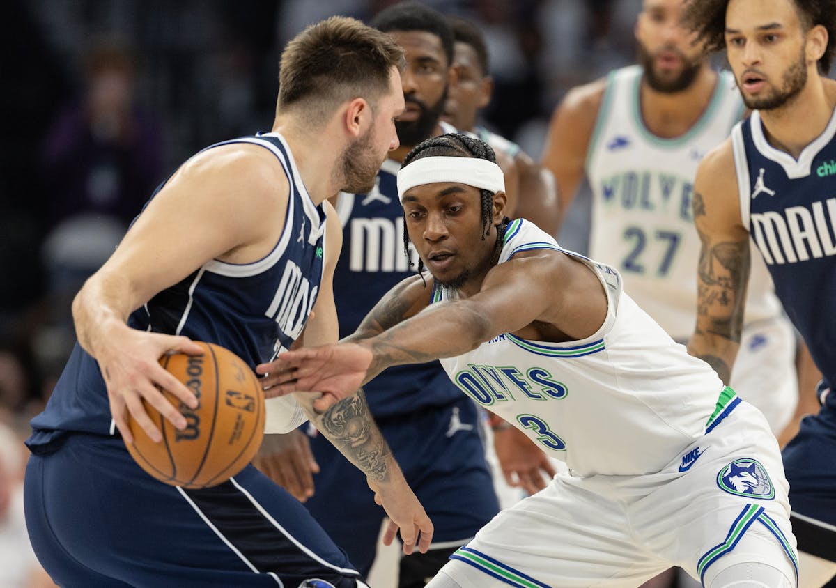 The Mavericks' Luka Doncic is defended by the Timberwolves' Jaden McDaniels during the first quarter of Game 1 of the Western Conference finals.