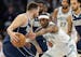 The Mavericks' Luka Doncic is defended by the Timberwolves' Jaden McDaniels during the first quarter of Game 1 of the Western Conference finals.