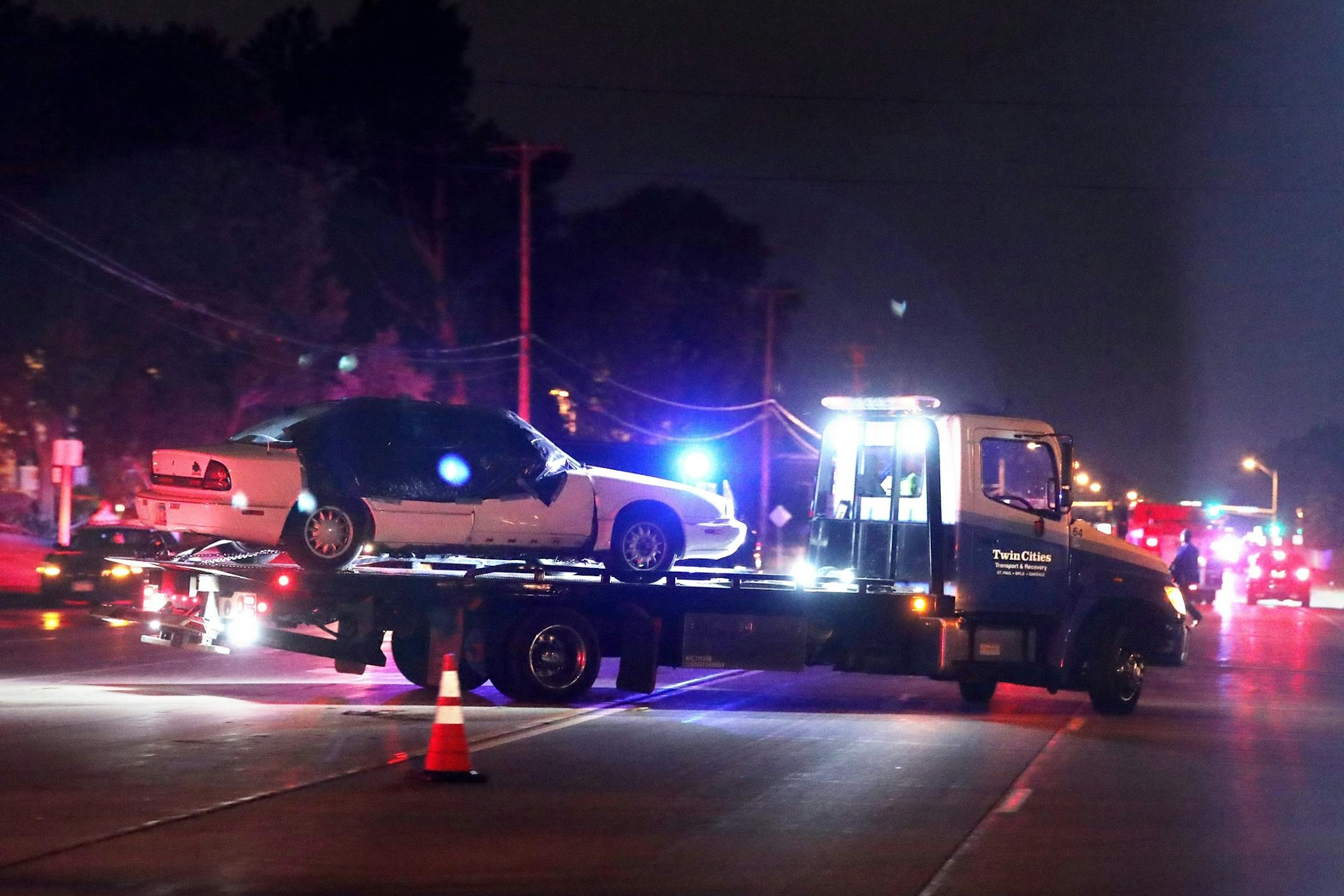 A car is towed away from the scene of Philando Castile's shooting in Falcon Heights on Wednesday, July 6, 2016.