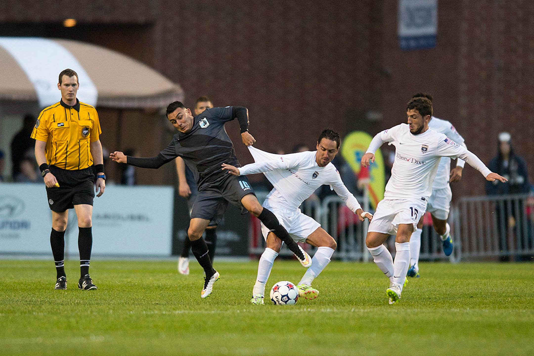 Minnesota United FC's Miguel Ibarra (10) pulled the jersey of Jacksonville Armada FC's Bochy Hoyos while battling for the ball Saturday night. ] Aaron Lavinsky • aaron.lavinsky@startribune.com Minnesota United FC played Jacksonville on Saturday, May 23, 2015 at the National Sports Center in Blaine.