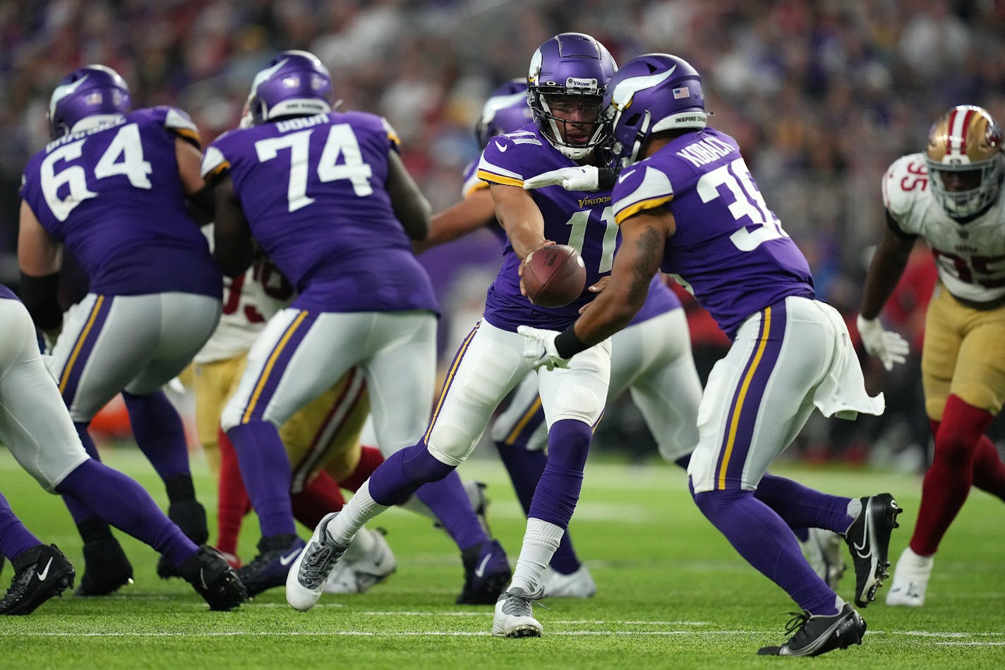 Minnesota Vikings quarterback Kellen Mond (11) hands the ball off to Minnesota Vikings running back Bryant Koback (38) in the third quarter of an NFL Preseason game between the Minnesota Vikings and the San Francisco 49ers Saturday, Aug. 20, 2022 at U.S. Bank Stadium in Minneapolis. ] ANTHONY SOUFFLE • anthony.souffle@startribune.com