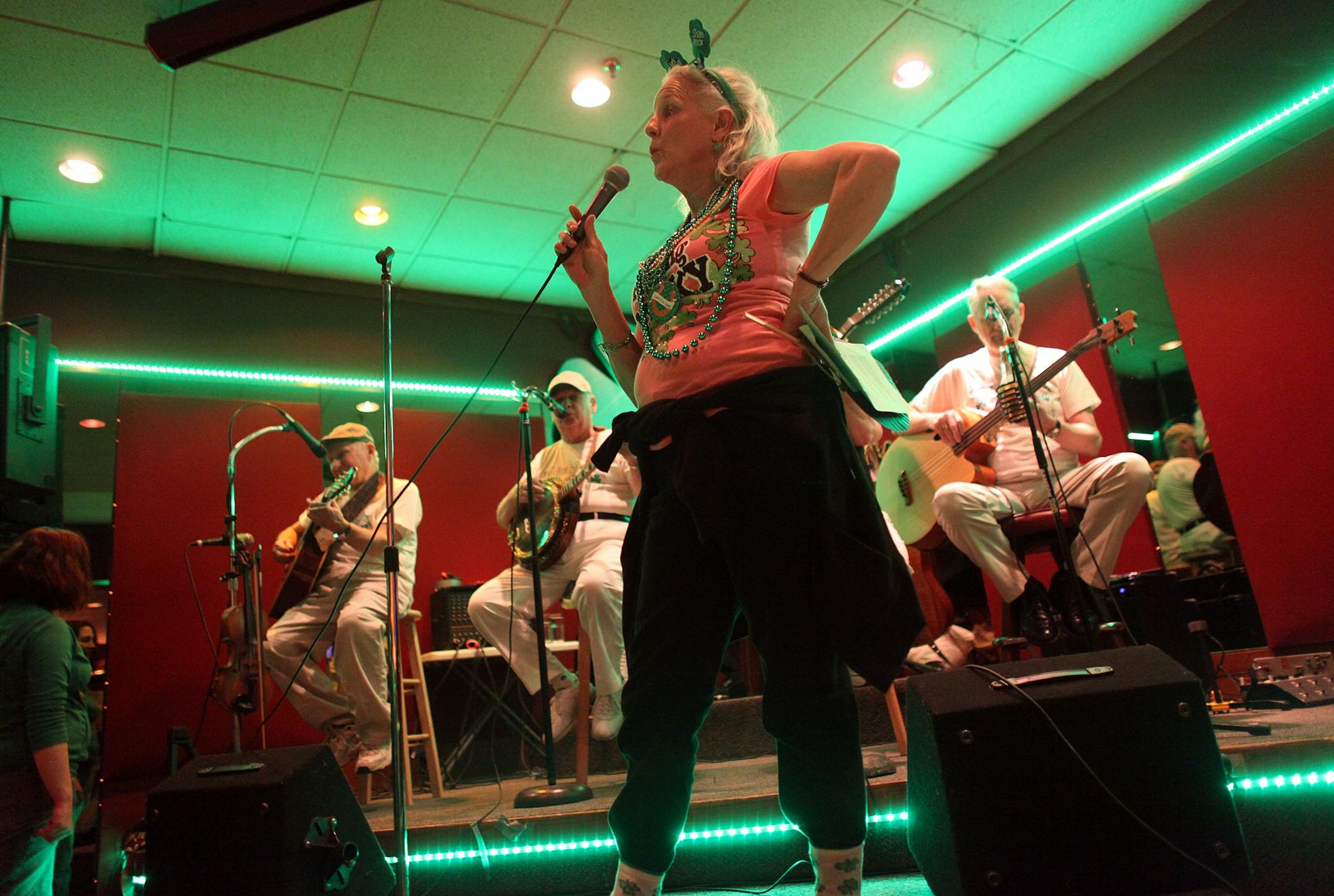 Sandra White put her hand on her hip as she turned toward a crowd boo-ing her as she sang in the Worlds Worst Irish Tenor contest Wednesday at Mancini's in St. Paul.