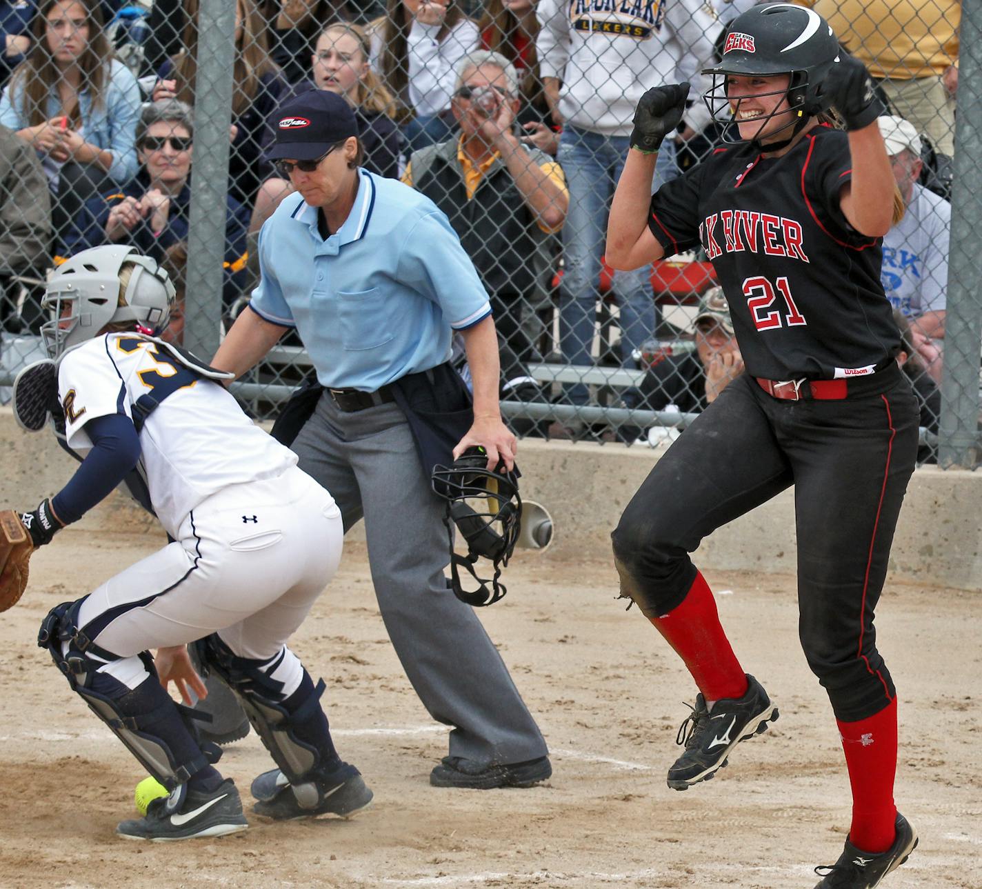 Girls Fast Pitch Softball Championships. Elk River Vs. Prior Lake in 3A competition. Elk River won 4-3. Elk River's Jayme Langbehn (21) celebrated after scoring the winning run in the 7th inning beating the throw to Prior Lake catcher Kara Lattery, left. (MARLIN LEVISON/STARTRIBUNE(mlevison@startribune.com (cq all names program)