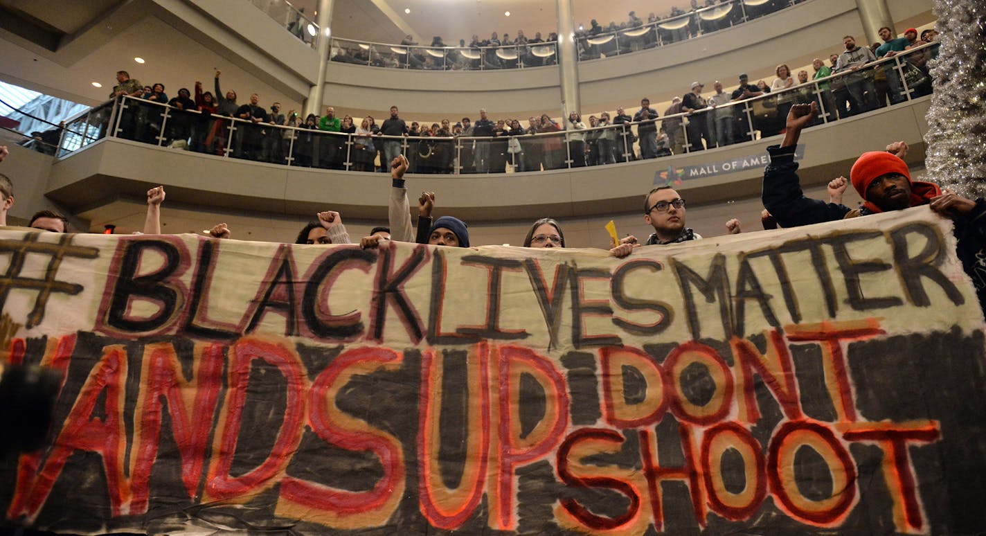 Demonstrators filled the Mall of America rotunda and chanted "Black lives matter" to protest police brutality, Saturday, Dec. 12, 2014, in Bloomington, Minn. The group Black Lives Matter Minneapolis had more than 3,000 people confirm on Facebook that they would attend. Attendance figures weren't immediately available. (AP Photo/The Star Tribune, Aaron Lavinsky) ORG XMIT: MIN2015011814105351 ORG XMIT: MIN1501181430293903