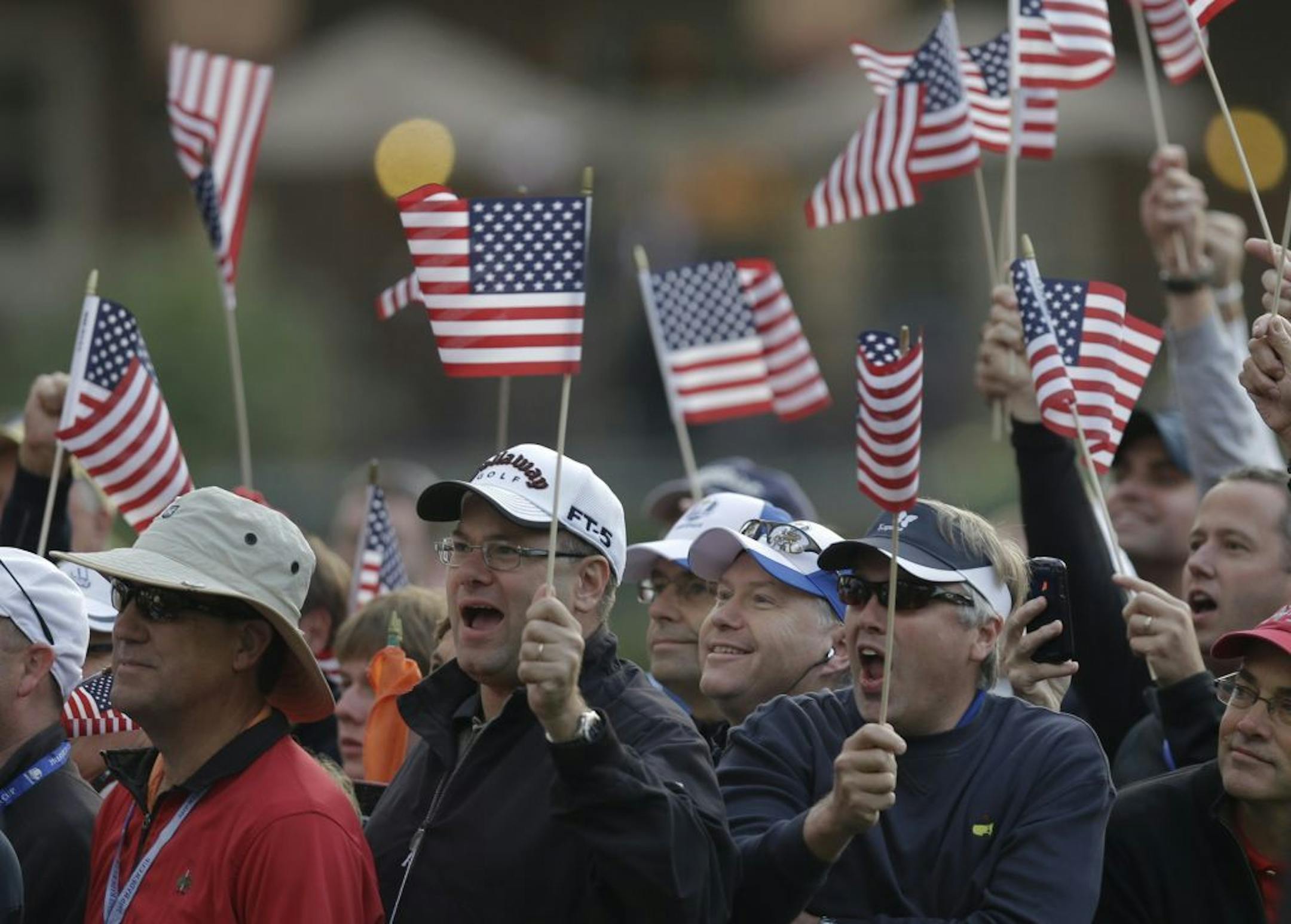 Fans cheer on the first tee during the foursomes matches at the Ryder Cup PGA golf tournament Friday, Sept. 28, 2012, at the Medinah Country Club in Medinah, Ill.