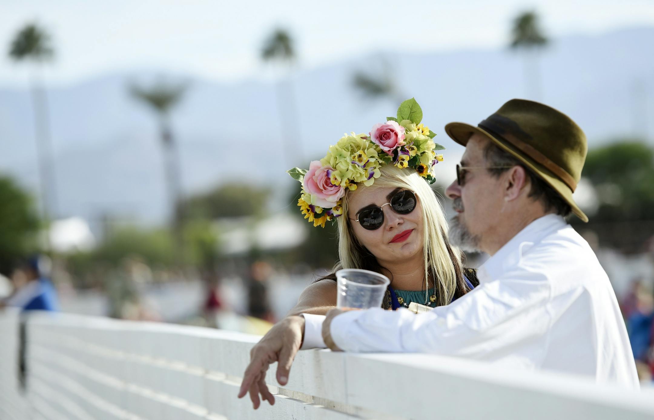 Pebbles Russell, left, of Brooklyn, NY, and her father William Russell mingle on the Empire Polo Field on day 1 of the 2016 Desert Trip music festival on Friday, Oct. 7, 2016, in Indio, Calif.
