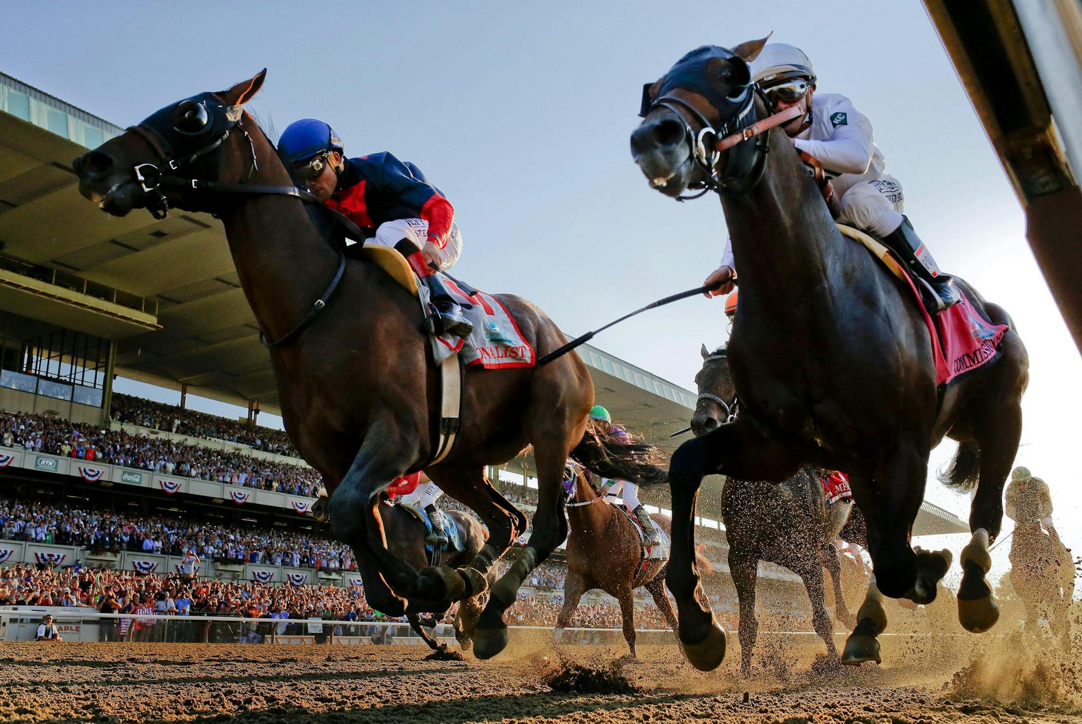 Tonalist, left, with Joel Rosario up edges out Commissioner with Javier Castellano up to win the 146th running of the Belmont Stakes horse race, Saturday, June 7, 2014, in Elmont, N.Y. (AP Photo/Matt Slocum)