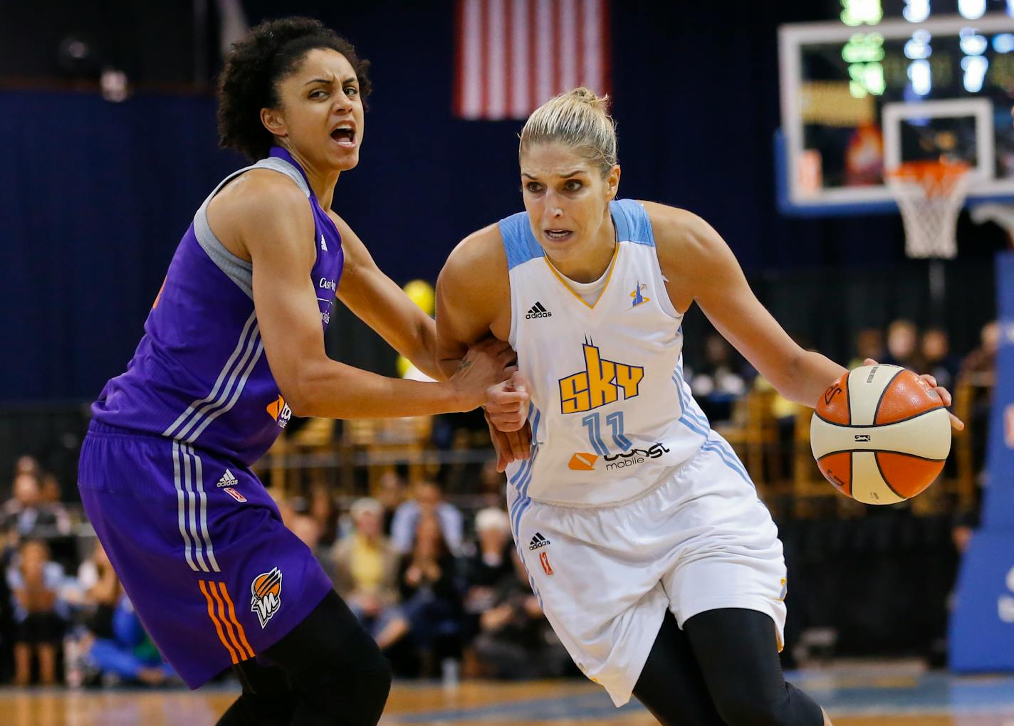 Chicago Sky forward Elena Delle Donne (11), goes to the basket against Phoenix Mercury forward Candice Dupree (4), during the second half of Game 3 of the WNBA Finals basketball series, Friday, Sept. 12, 2014, in Chicago. Phoenix Mercury defeated the Chicago Sky 87-82 and swept the WNBA Finals. (AP Photo/Kamil Krzaczynski)