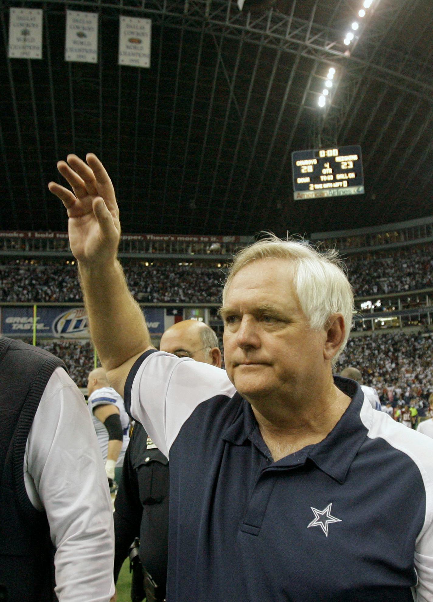 Dallas Cowboys head coach Wade Phillips waves to Washington Redskins head coach Joe Gibbs after their NFL football game, Sunday, Nov. 18, 2007, in Irving, Texas. Dallas won, 28-23.