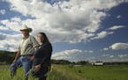 Willard Drysdale with his daughter, Chelsea, who helps run his cattle operation. The field to the right, which is pasture in the foreground, and plant