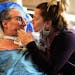 Grubb got a kiss from his wife Kelly before healthcare workers gathered to say goodbye before he was discharged from HCMC Monday in Minneapolis