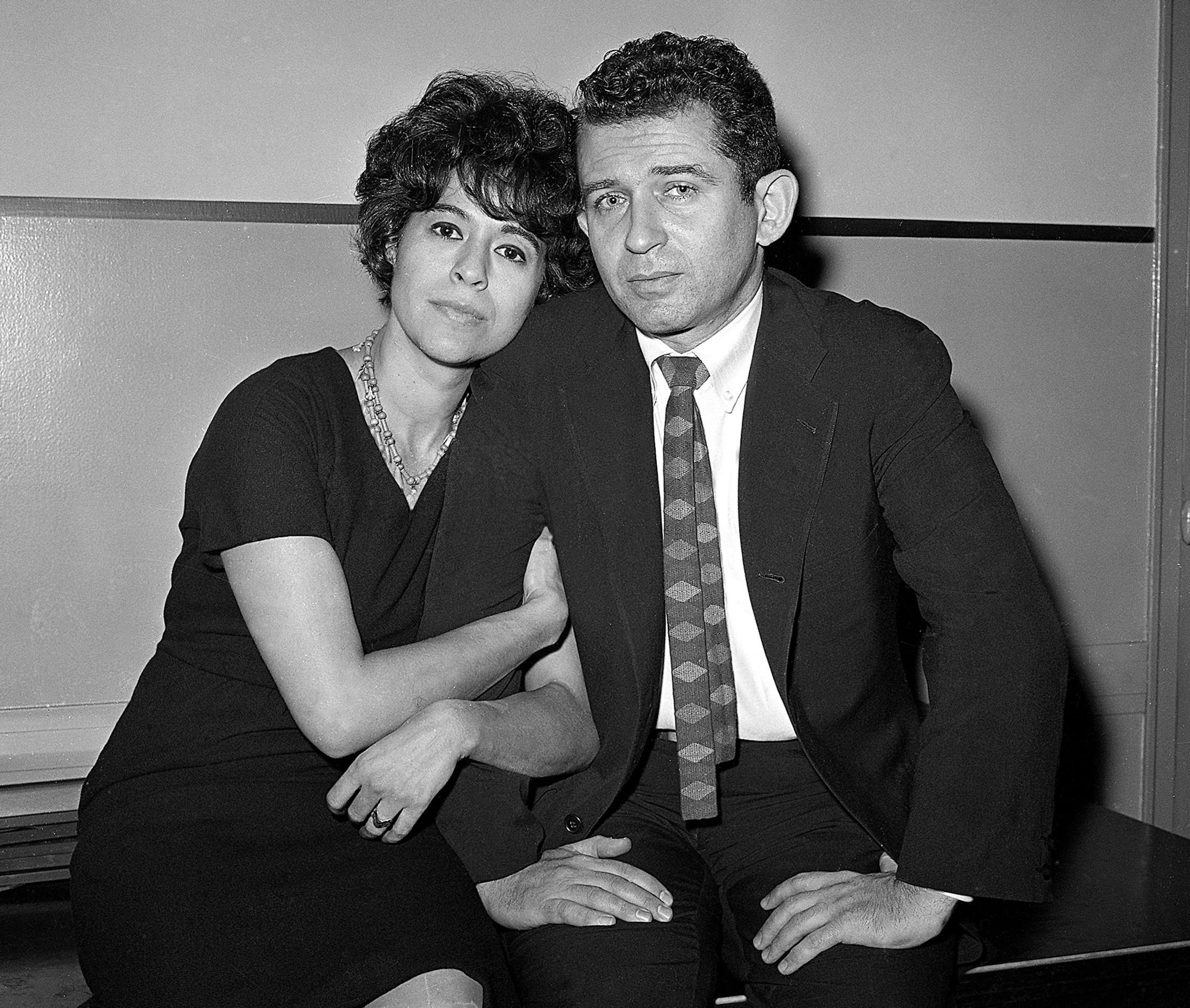 FILE - In this Dec. 29, 1960 file photo, author Norman Mailer and his wife, Adele, sit together in court as Norman Mailer answers an assault charge that he stabbed Adele after a party at their apartment. Mrs. Mailer declined to press charges. Adele Mailer died Sunday, Nov. 22, 2015, of pneumonia in New York, according to her daughter, Danielle Mailer. She was 90. The Mailers, who had two children, divorced in 1962. Norman Mailer died Nov. 10, 2007 at age 84. (AP Photo/Anthony Camerano, FIle)