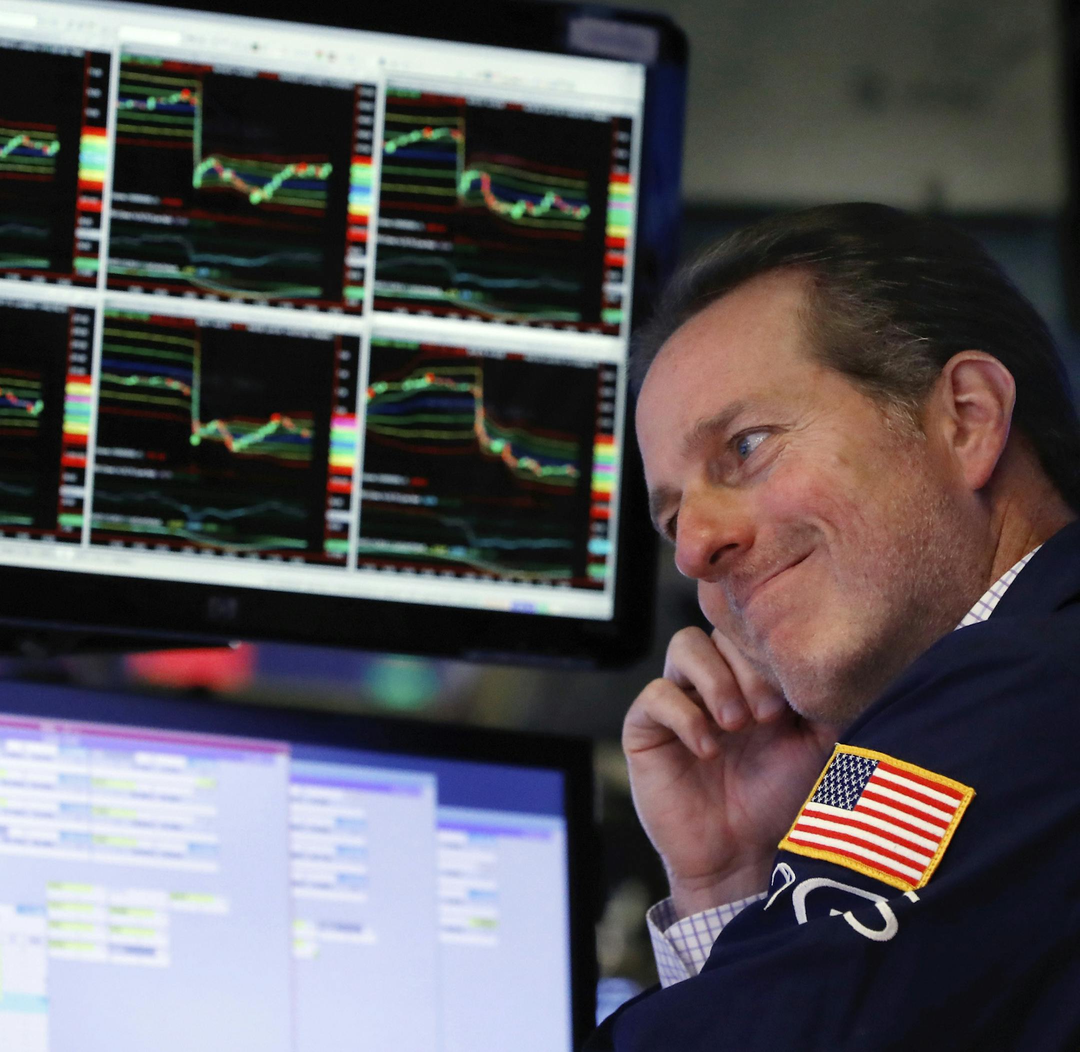 FILE- In this Oct. 23, 2018, file photo specialist Glenn Carell works at his post on the floor of the New York Stock Exchange. More than any other group, companies themselves are the largest purchasers of their own shares. But they were notably absent from the market the last few weeks, just as stock prices were tumbling on worries about global trade and rising interest rates. (AP Photo/Richard Drew, File) ORG XMIT: NYBZ471