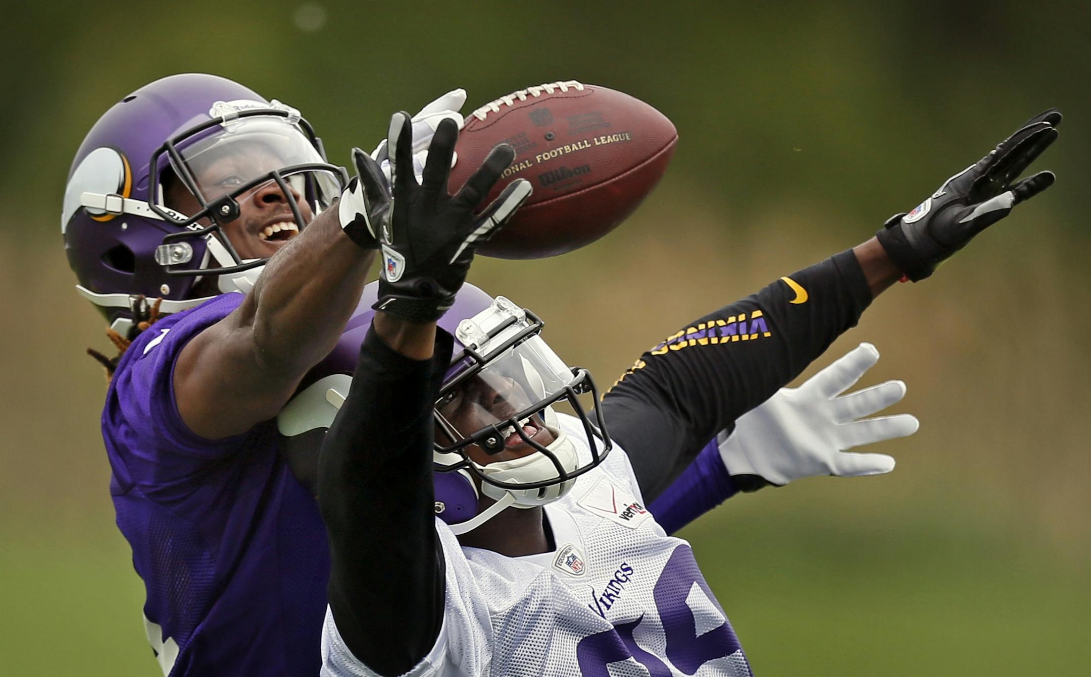 Vikings rookie defensive back Xavier Rhodes (right) battled rookie receiver Cordarrelle Patterson for a pass at Winter Park during organized team activities.