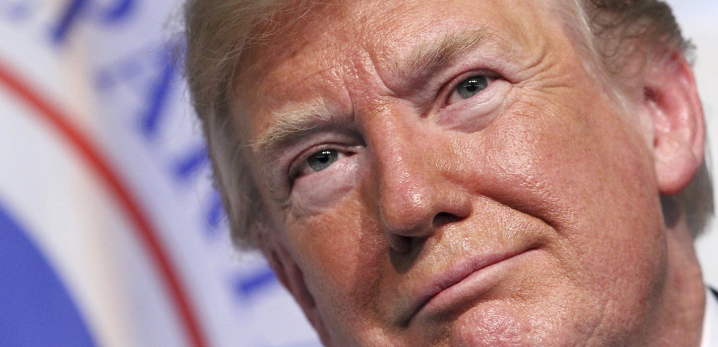 In this June 1, 2018 photo, President Donald Trump attends a Change of Command ceremony at the U.S. Coast Guard Headquarters in Washington. Trump is defending his tough trade negotiations with China, Canada and Mexico, saying that U.S. farmers have been treated "unfairly." The president says on Twitter that by the time he finishes his trade negotiations, "that will change" and big trade barriers "will finally be broken." (AP Photo/Jacquelyn Martin)