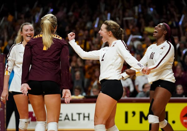 Minnesota players, including defensive specialist Lauren Barnes (2), celebrated a 3-0 sweep over Penn State in September. The Gophers defeated Nebrask