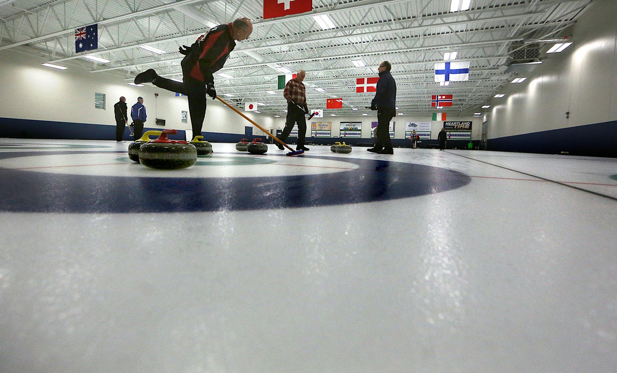 Lyle Clausen, Blaine (left), watched a stone as it approached slid toward him along the ice. ] JIM GEHRZ ï james.gehrz@startribune.com / Blaine, MN / August 6, 2015 / 10:00 AM ñ BACKGROUND INFORMATION: The Four Seasons Curling Club at Fogerty Arena was named an official U.S. Olympic Training Site. Fogerty Arena is the 18th Olympic Training Site in the United States and the first of its kind in Minnesota. It is the only U.S. Olympic Training Site dedicated to the sport of curling.
