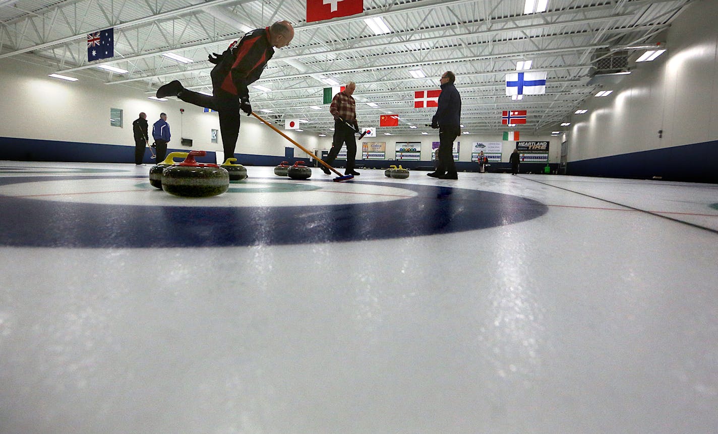 Lyle Clausen, Blaine (left), watched a stone as it approached slid toward him along the ice. ] JIM GEHRZ &#xef; james.gehrz@startribune.com / Blaine, MN / August 6, 2015 / 10:00 AM &#xf1; BACKGROUND INFORMATION: The Four Seasons Curling Club at Fogerty Arena was named an official U.S. Olympic Training Site. Fogerty Arena is the 18th Olympic Training Site in the United States and the first of its kind in Minnesota. It is the only U.S. Olympic Training Site dedicated to the sport of curling.