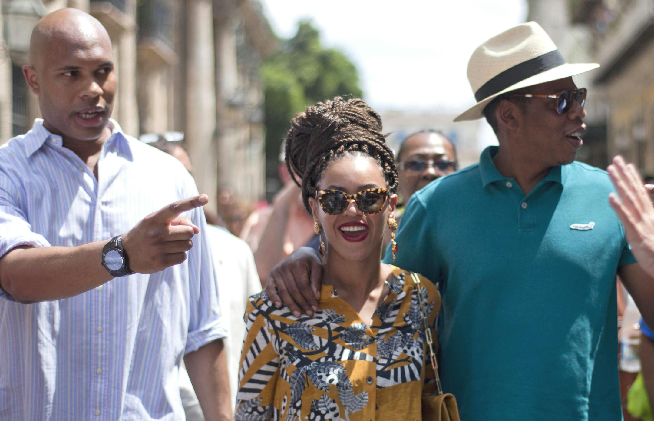 U.S. singer Beyonce and her husband, rapper Jay-Z, right, tours Old Havana as a body guard, left, and tour guide, right, accompany them in Cuba in early April.