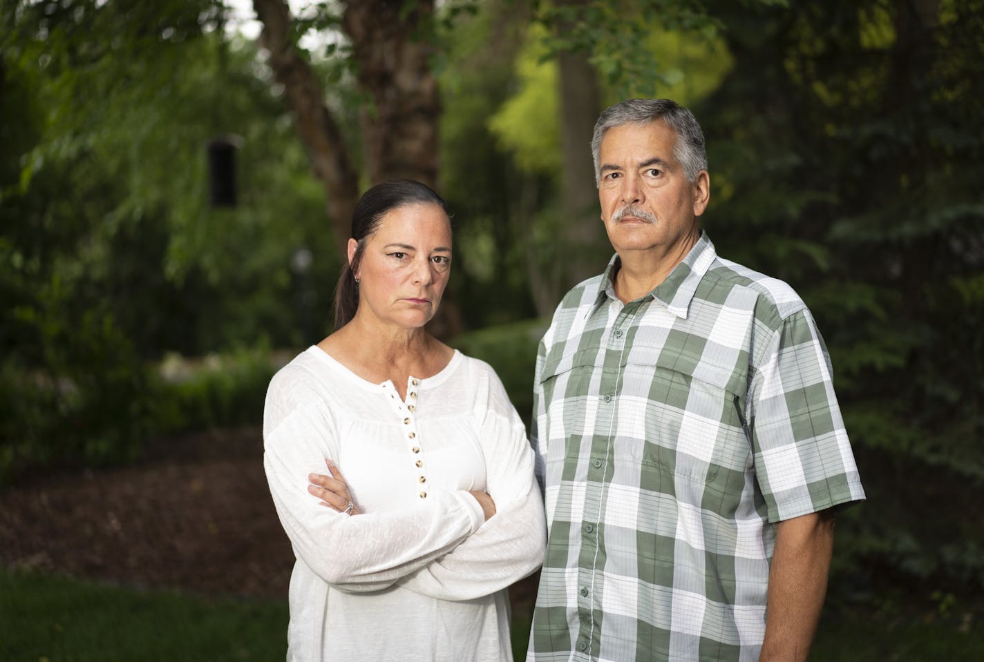 Gina and John Nichols posed for a photo at the home in Little Canada, Minn., on Monday, June 22, 2020. Their daughter, Maggie Nichols, is the focus of a new Netflix documentary on her story of being the first gymnast to share her experience with her coach on Larry Nassar's abuse. ] RENEE JONES SCHNEIDER renee.jones@startribune.com