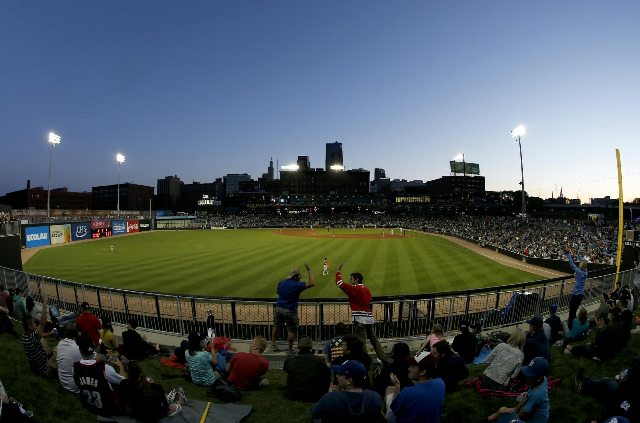 Fans celebrated a St. Paul Saints homerun in the fourth inning. ] CARLOS GONZALEZ cgonzalez@startribune.com, May 21, 2015, St Paul, MN, CHS Field, St. Paul Saints Baseball, First game at the new CHS Field