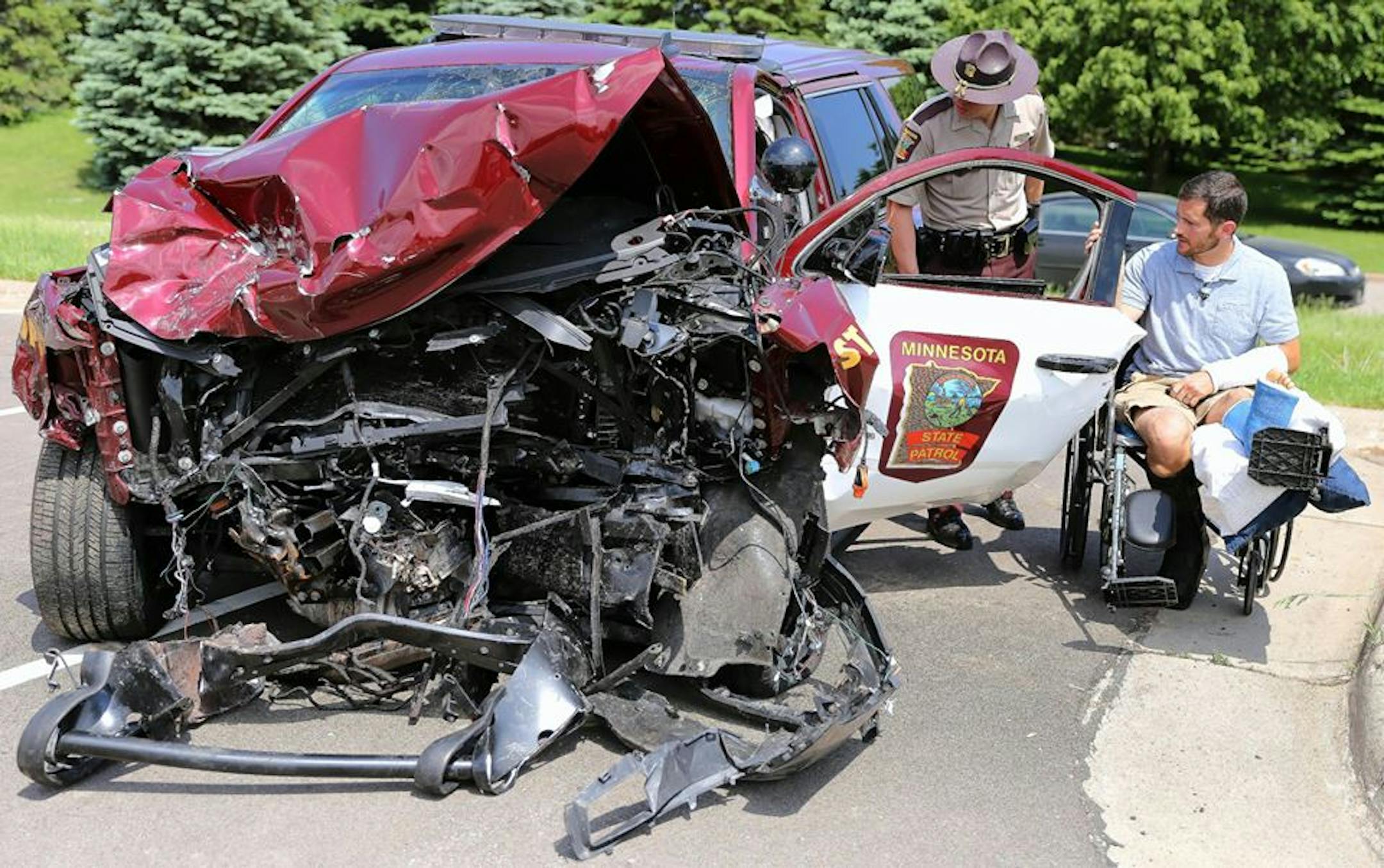 State Patrol Sgt. Mike Krukowski looked over on Thursday what was left of his SUV after a May 15 head-on crash along Interstate 35 in Lakeville. Krukowski credited his seat beat for saving his life. The other driver in the crash was killed.