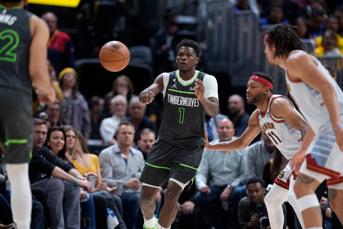 Minnesota Timberwolves guard Anthony Edwards (1) and Denver Nuggets forward Bruce Brown (11) in the second half of Game 5 of an NBA basketball first-round playoff series Tuesday, April 25, 2023, in Denver. (AP Photo/David Zalubowski)