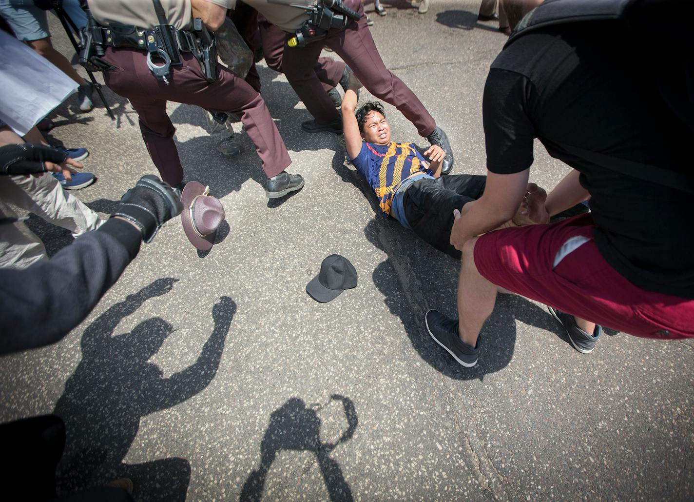 An "anti-sharia law" group and counterprotesters clashed during dueling rallies at the Minnesota State Capitol, Saturday, June 10, 2017 in St. Paul.