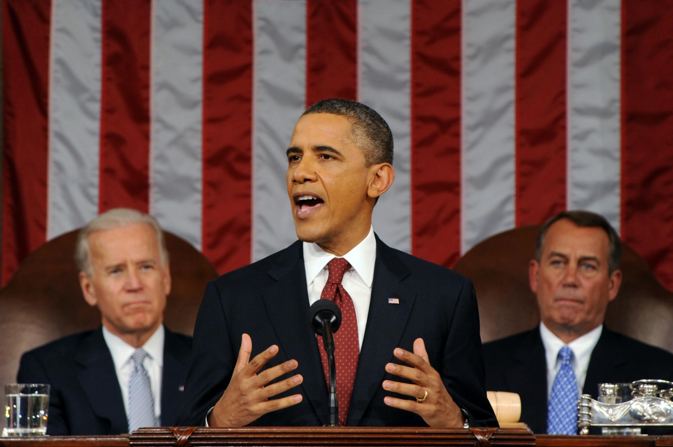 President Barack Obama delivers his State of the Union address on Capitol Hill in Washington, Tuesday, Jan. 24, 2012. Listen in back are Vice President Joe Biden and House Speaker John Boehner, right.