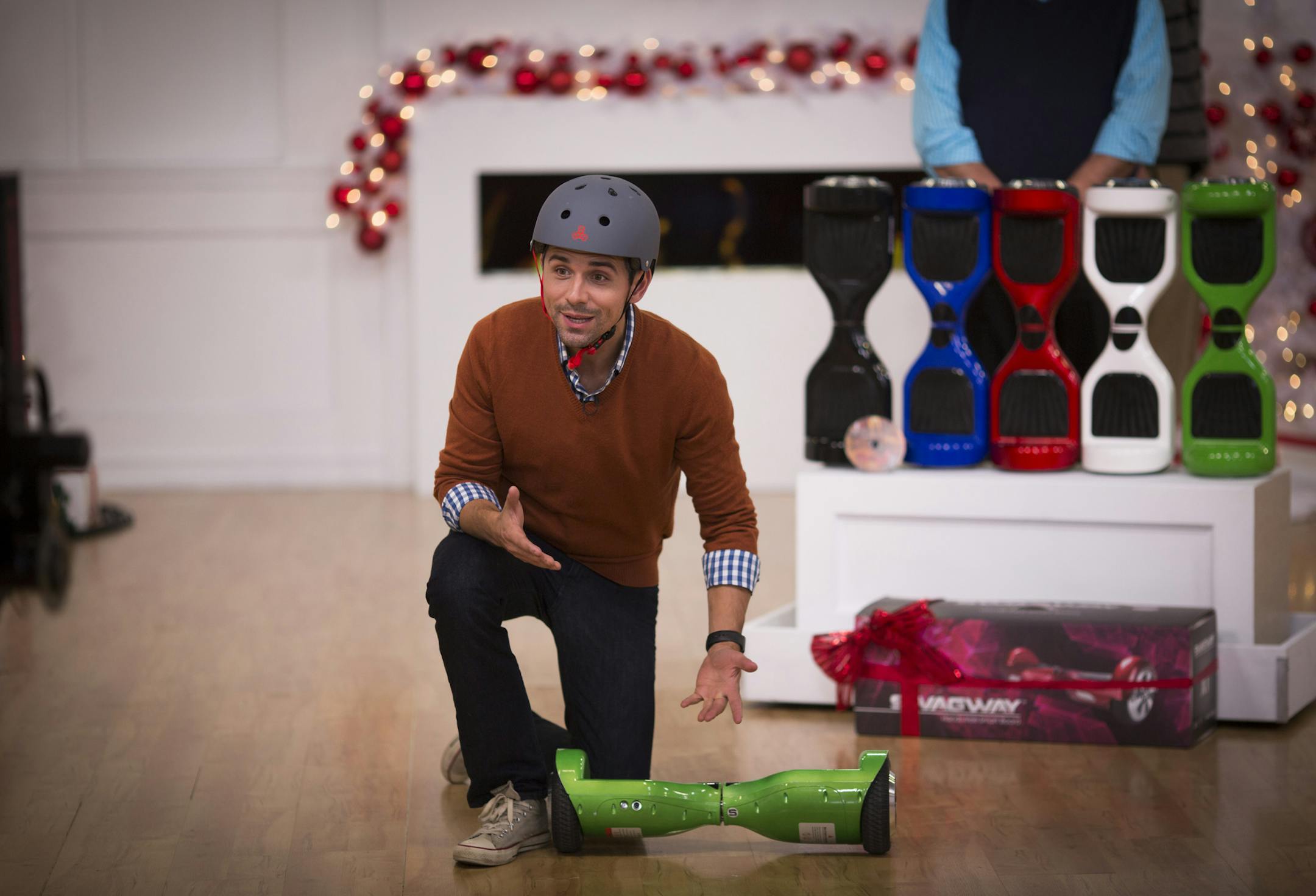 One of the holiday items featured in 2015 was hoverboards. Pictured in Evine's Eden Prairie studio was host Sasha Andreev. (RENEE JONES SCHNEIDER/ reneejones@startribune.com)